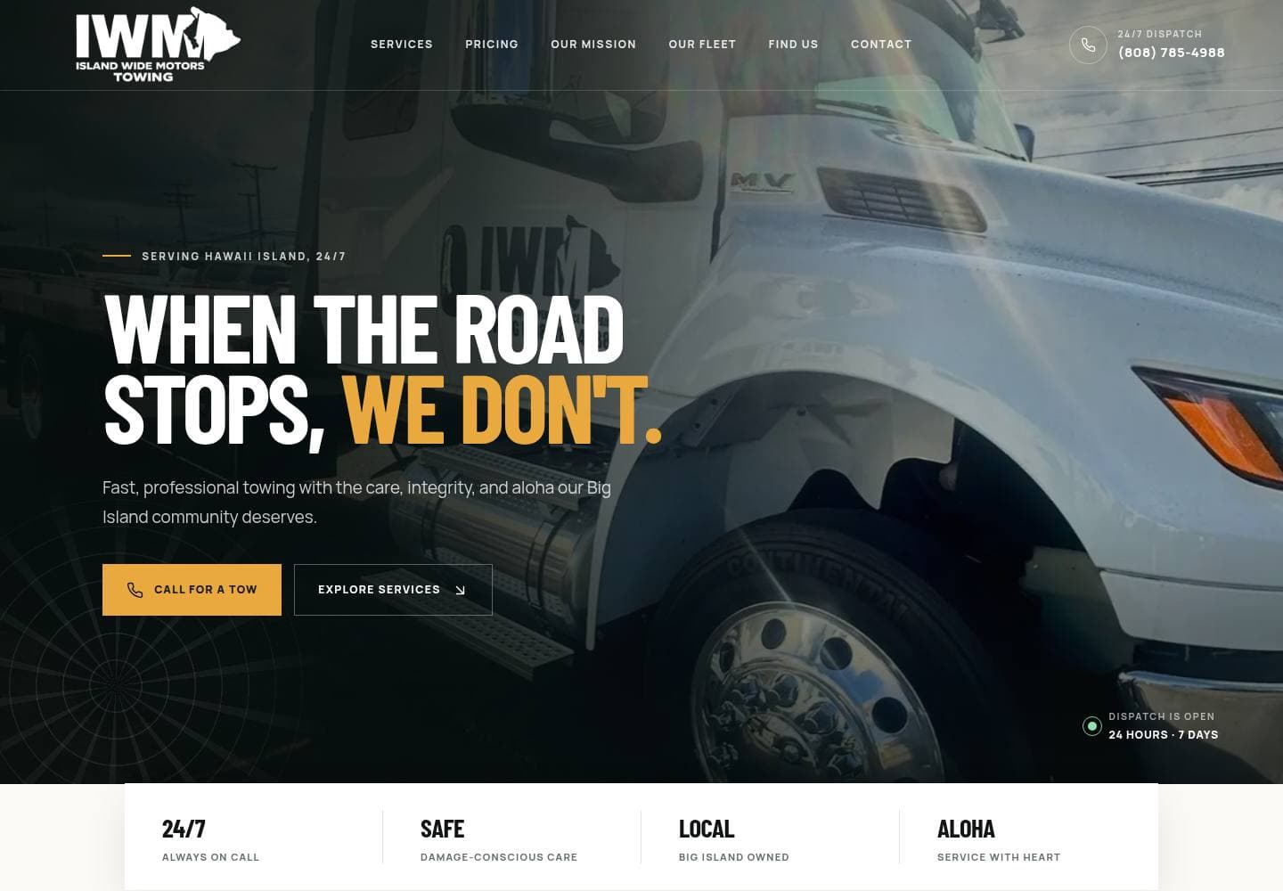 IWM Towing homepage with a flatbed truck and the line When the road stops, we don't